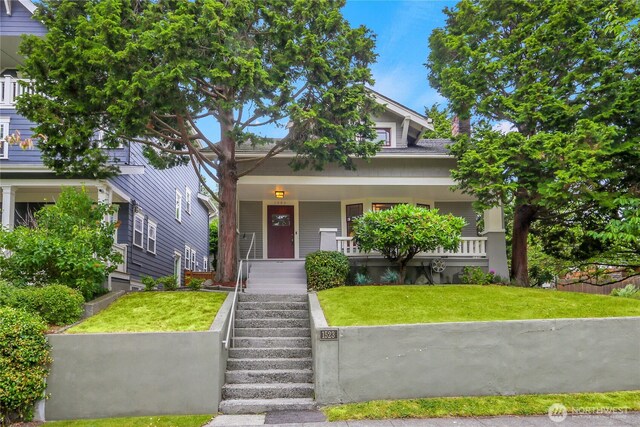 1523 4th Ave N, Seattle, WA 98109 - view of front of property with a front lawn and covered porch