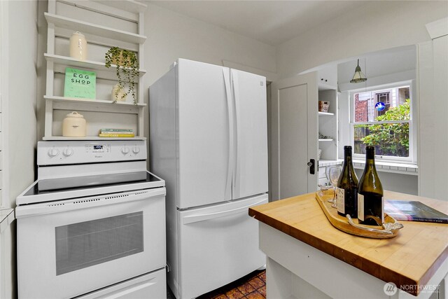 1523 4th Ave N, Seattle, WA 98109 - kitchen featuring white appliances, open shelves, and butcher block countertops