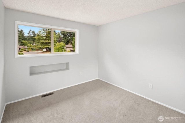4983 120th Ave SE, Bellevue, WA 98006 - empty room featuring carpet and a textured ceiling