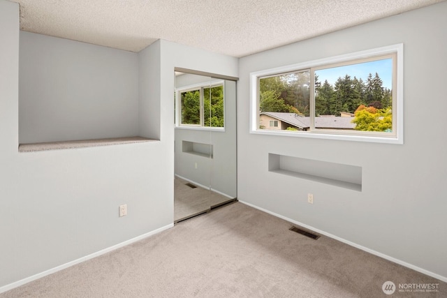 4983 120th Ave SE, Bellevue, WA 98006 - carpeted spare room featuring a textured ceiling