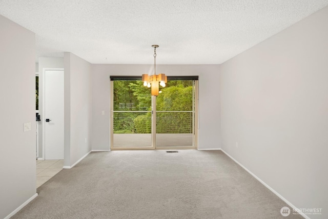 4983 120th Ave SE, Bellevue, WA 98006 - spare room featuring carpet floors, a chandelier, and a textured ceiling