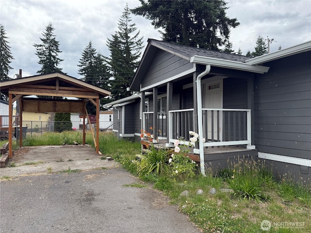 6411 201st Ave SW Unit 21, Centralia, WA 98531 - view of side of home featuring a porch and asphalt driveway