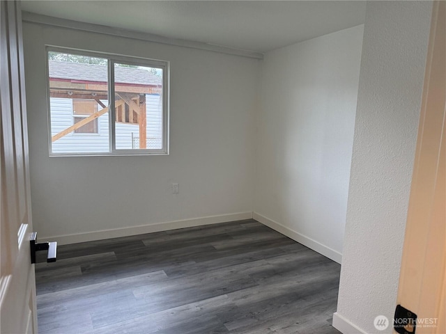 6411 201st Ave SW Unit 21, Centralia, WA 98531 - spare room featuring dark wood finished floors and baseboards