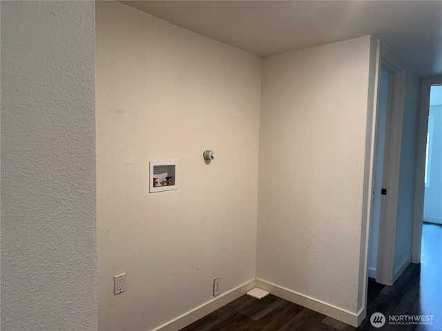 6411 201st Ave SW Unit 21, Centralia, WA 98531 - laundry area featuring washer hookup, dark wood-type flooring, and a textured wall