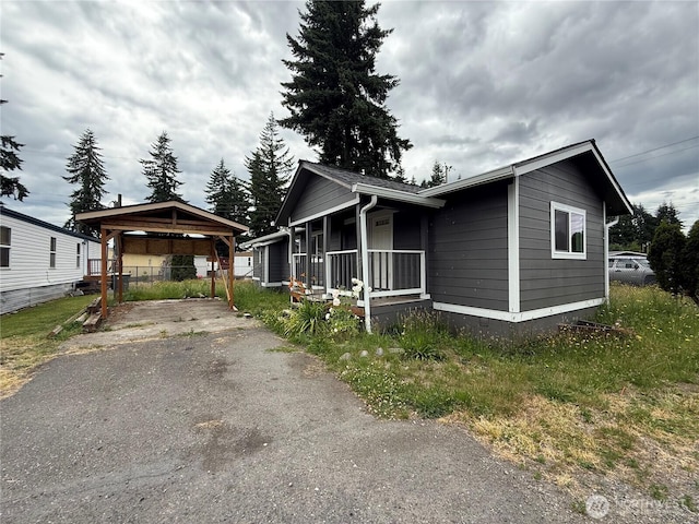 6411 201st Ave SW Unit 21, Centralia, WA 98531 - view of front of house with driveway, a carport, and a gazebo