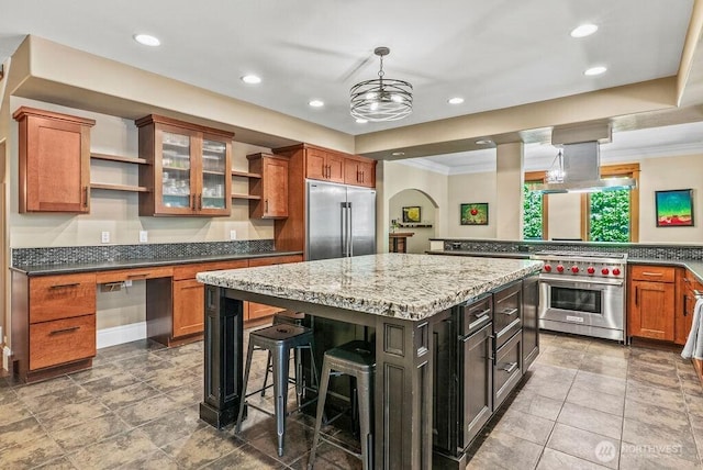 2608 Cascade Way, Longview, WA 98632 - kitchen with open shelves, high end appliances, ornamental molding, brown cabinetry, and a center island