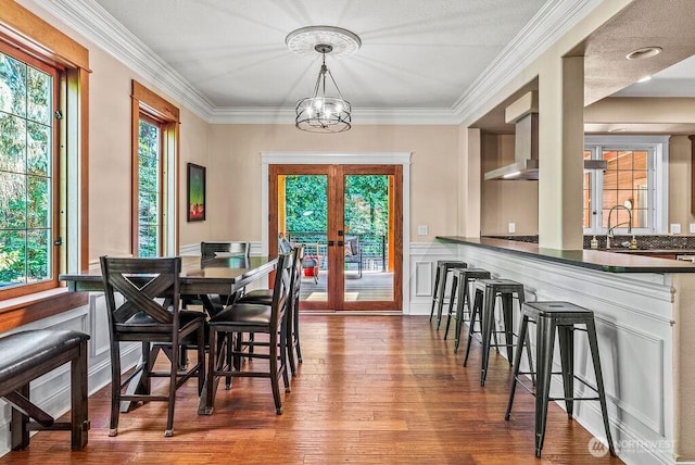 2608 Cascade Way, Longview, WA 98632 - dining room with french doors, wood finished floors, healthy amount of natural light, a chandelier, and ornamental molding