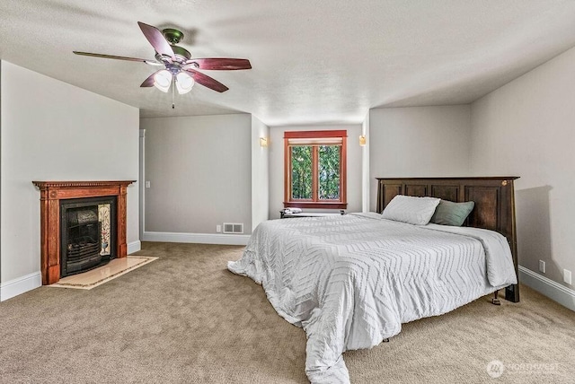 2608 Cascade Way, Longview, WA 98632 - carpeted bedroom with a ceiling fan and a fireplace