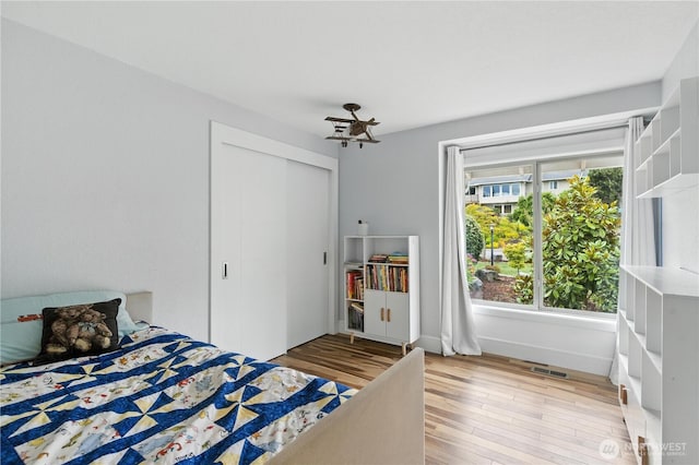 2500 171st Ave SE, Bellevue, WA 98008 - bedroom featuring light wood-style flooring and a closet