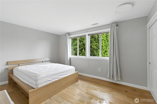 2500 171st Ave SE, Bellevue, WA 98008 - bedroom with hardwood / wood-style flooring and a closet
