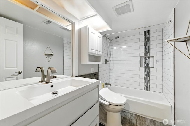 2500 171st Ave SE, Bellevue, WA 98008 - full bath featuring wood finished floors, vanity, and shower / tub combination