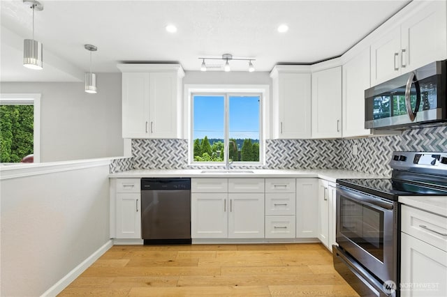 2500 171st Ave SE, Bellevue, WA 98008 - kitchen with appliances with stainless steel finishes, light countertops, tasteful backsplash, white cabinetry, and recessed lighting
