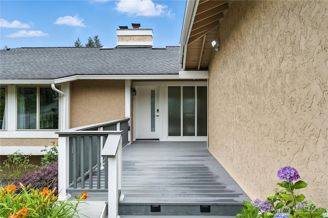 2500 171st Ave SE, Bellevue, WA 98008 - entrance to property featuring roof with shingles, stucco siding, and a chimney