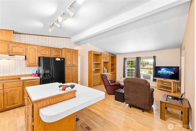 301 Salmonberry Ln, Friday Harbor, WA 98250 - kitchen featuring wallpapered walls, black appliances, under cabinet range hood, open floor plan, and a kitchen island