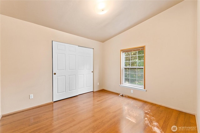 301 Salmonberry Ln, Friday Harbor, WA 98250 - unfurnished bedroom with wood finished floors and lofted ceiling