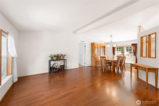301 Salmonberry Ln, Friday Harbor, WA 98250 - dining space with wood finished floors, a chandelier, and beam ceiling