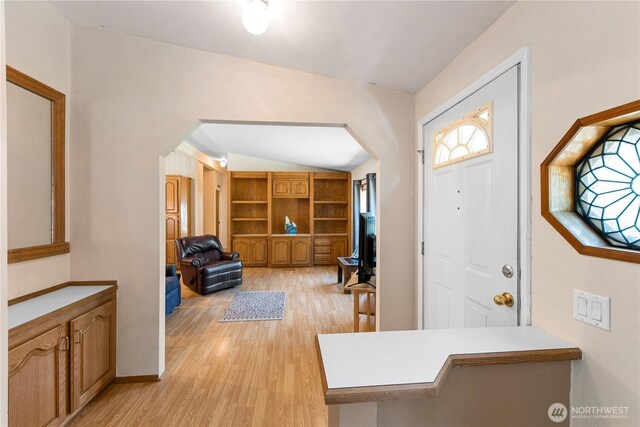 301 Salmonberry Ln, Friday Harbor, WA 98250 - entryway featuring arched walkways, light wood finished floors, and vaulted ceiling