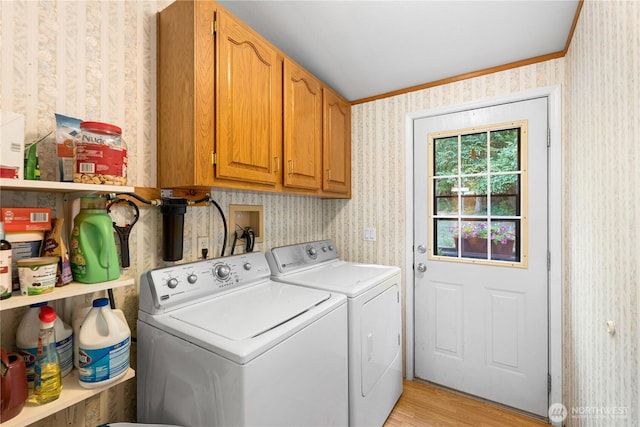 301 Salmonberry Ln, Friday Harbor, WA 98250 - laundry area with wallpapered walls, separate washer and dryer, cabinet space, light wood-style floors, and ornamental molding