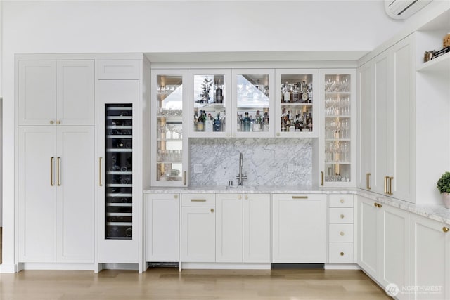 405 Bayside Rd, Bellingham, WA 98225 - indoor wet bar with a wall mounted air conditioner, light wood-style flooring, and tasteful backsplash