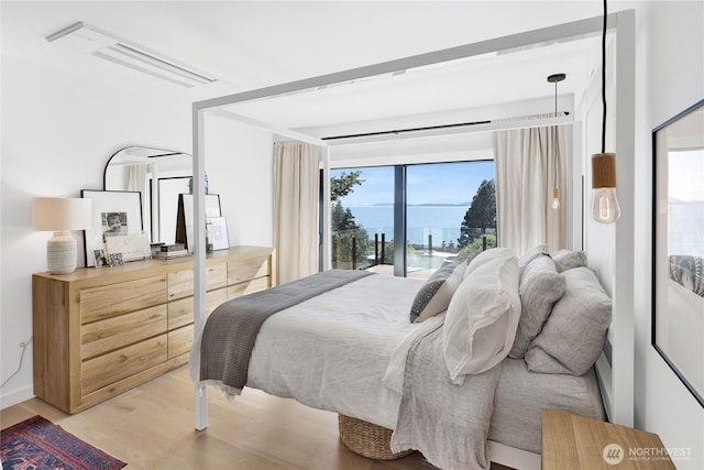 405 Bayside Rd, Bellingham, WA 98225 - bedroom with light wood-type flooring and access to exterior