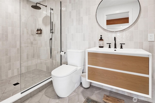 405 Bayside Rd, Bellingham, WA 98225 - full bath featuring tile walls, vanity, a tile shower, tile patterned flooring, and backsplash