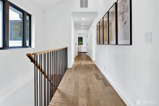 405 Bayside Rd, Bellingham, WA 98225 - hallway featuring an upstairs landing, wood finished floors, and recessed lighting