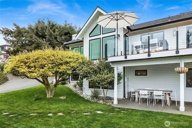405 Bayside Rd, Bellingham, WA 98225 - rear view of property with a balcony and a lawn