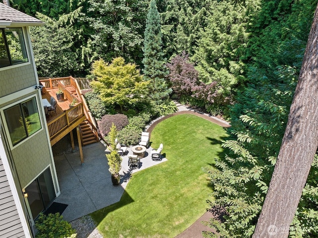 2507 101st Ln NE, Bellevue, WA 98004 - view of grassy yard with a wooden deck, a patio area, stairway, and an outdoor fire pit