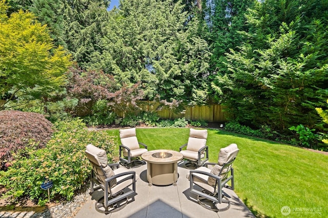 2507 101st Ln NE, Bellevue, WA 98004 - view of patio featuring a fire pit and a wooded view