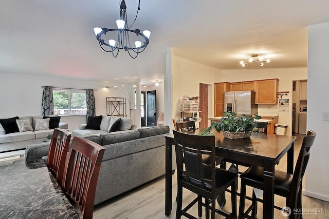 5845 Alpha Ln, Freeland, WA 98249 - dining space with a chandelier and light wood-style flooring