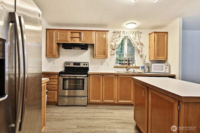 5845 Alpha Ln, Freeland, WA 98249 - kitchen featuring stainless steel appliances, under cabinet range hood, and light countertops