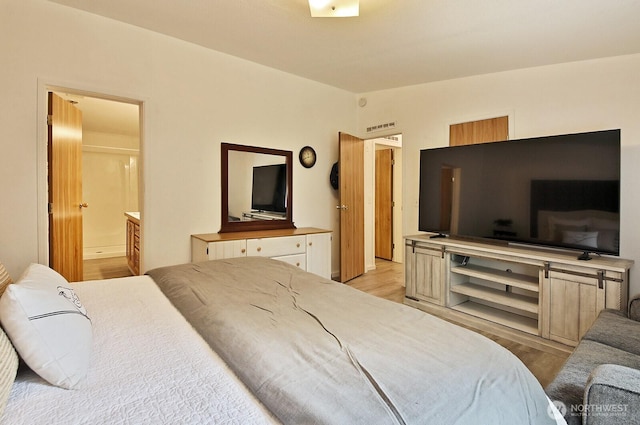 5845 Alpha Ln, Freeland, WA 98249 - bedroom featuring light wood-style flooring and ensuite bathroom