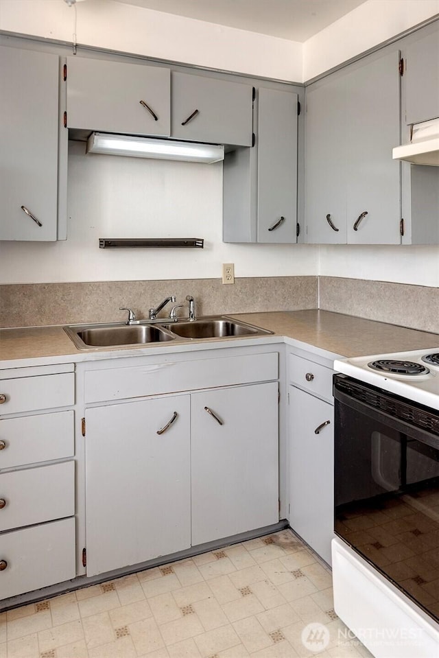 1211 108th St SW, Everett, WA 98204 - kitchen featuring electric stove, light floors, gray cabinetry, light countertops, and under cabinet range hood