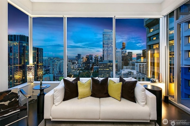 737 Olive Way Unit 3606, Seattle, WA 98101 - living room featuring wood finished floors, a city view, and healthy amount of natural light