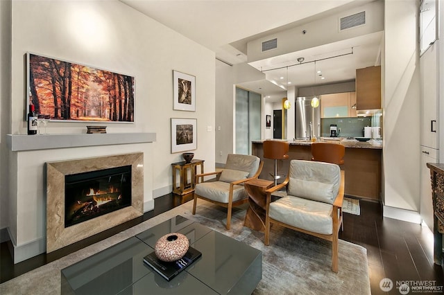 737 Olive Way Unit 3606, Seattle, WA 98101 - living room featuring wood finished floors and a premium fireplace