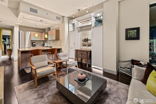 737 Olive Way Unit 3606, Seattle, WA 98101 - living area featuring rail lighting and dark wood-style floors