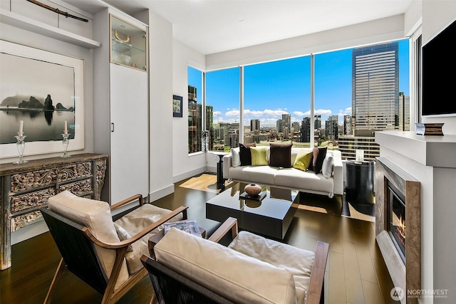 737 Olive Way Unit 3606, Seattle, WA 98101 - living room with wood finished floors and a premium fireplace