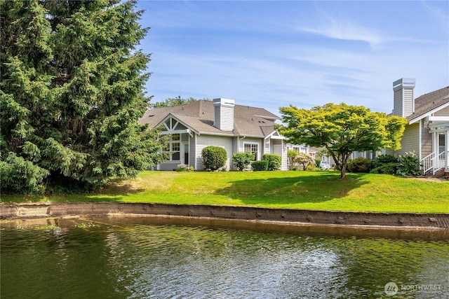 23302 53rd Ave S Unit 4-1, Kent, WA 98032 - rear view of property featuring a water view, a chimney, and a yard