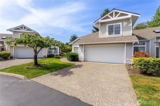 23302 53rd Ave S Unit 4-1, Kent, WA 98032 - view of front of house featuring driveway, a shingled roof, a garage, and a front yard