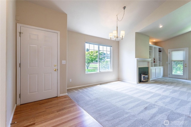 23302 53rd Ave S Unit 4-1, Kent, WA 98032 - entrance foyer featuring a chandelier, light wood-type flooring, and light colored carpet