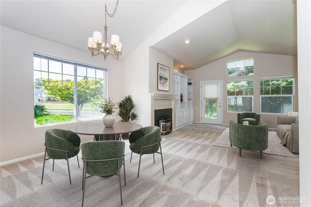 23302 53rd Ave S Unit 4-1, Kent, WA 98032 - dining area with carpet flooring, lofted ceiling, a fireplace with flush hearth, and a chandelier