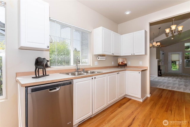 23302 53rd Ave S Unit 4-1, Kent, WA 98032 - kitchen with stainless steel dishwasher, light wood-style floors, light countertops, a chandelier, and recessed lighting