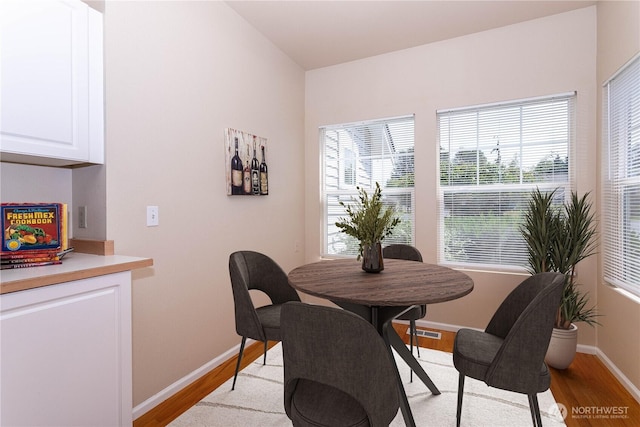 23302 53rd Ave S Unit 4-1, Kent, WA 98032 - dining room featuring light wood-style floors and healthy amount of natural light