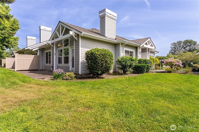 23302 53rd Ave S Unit 4-1, Kent, WA 98032 - view of side of property featuring a chimney and a lawn