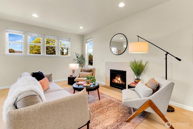 4241 S Eddy St, Seattle, WA 98118 - living room featuring recessed lighting, a lit fireplace, and light wood-style floors