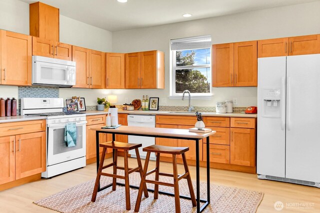 4241 S Eddy St, Seattle, WA 98118 - kitchen featuring white appliances, light wood finished floors, recessed lighting, and light countertops