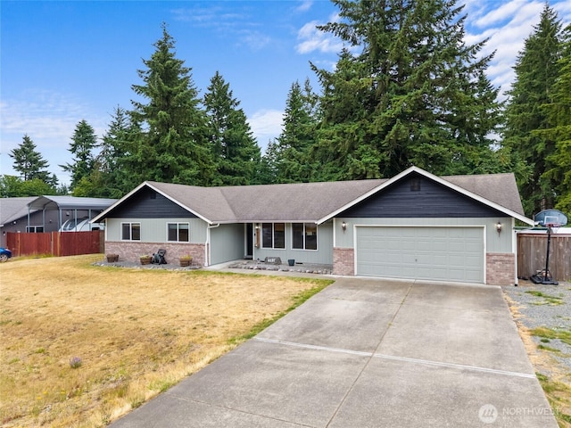6137 189th Loop SW, Rochester, WA 98579 - ranch-style home featuring brick siding, a garage, driveway, and a shingled roof