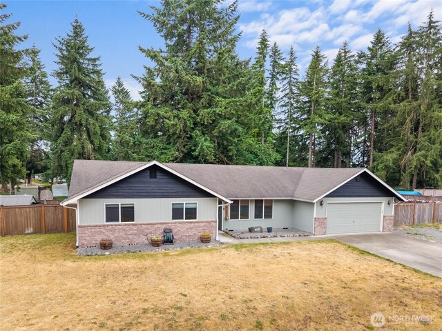 6137 189th Loop SW, Rochester, WA 98579 - single story home featuring brick siding, an attached garage, concrete driveway, and roof with shingles
