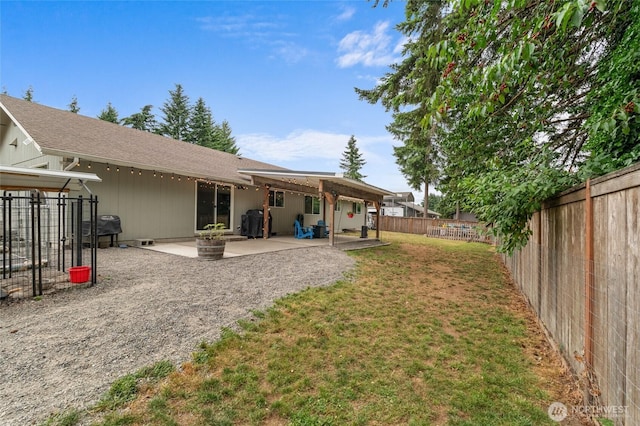 6137 189th Loop SW, Rochester, WA 98579 - back of house with a patio area and a fenced backyard