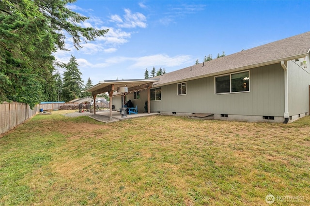 6137 189th Loop SW, Rochester, WA 98579 - rear view of property featuring a patio area, crawl space, a fenced backyard, and a shingled roof